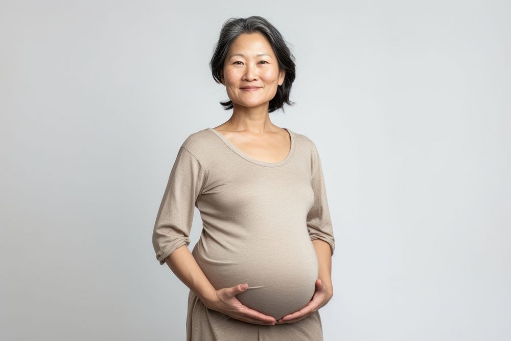 Older asian woman pregnant portrait sleeve smile.