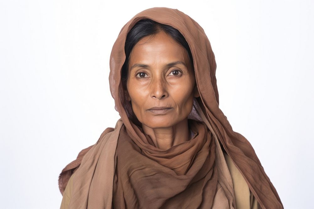 Pakistani middle aged woman portrait scarf contemplation.