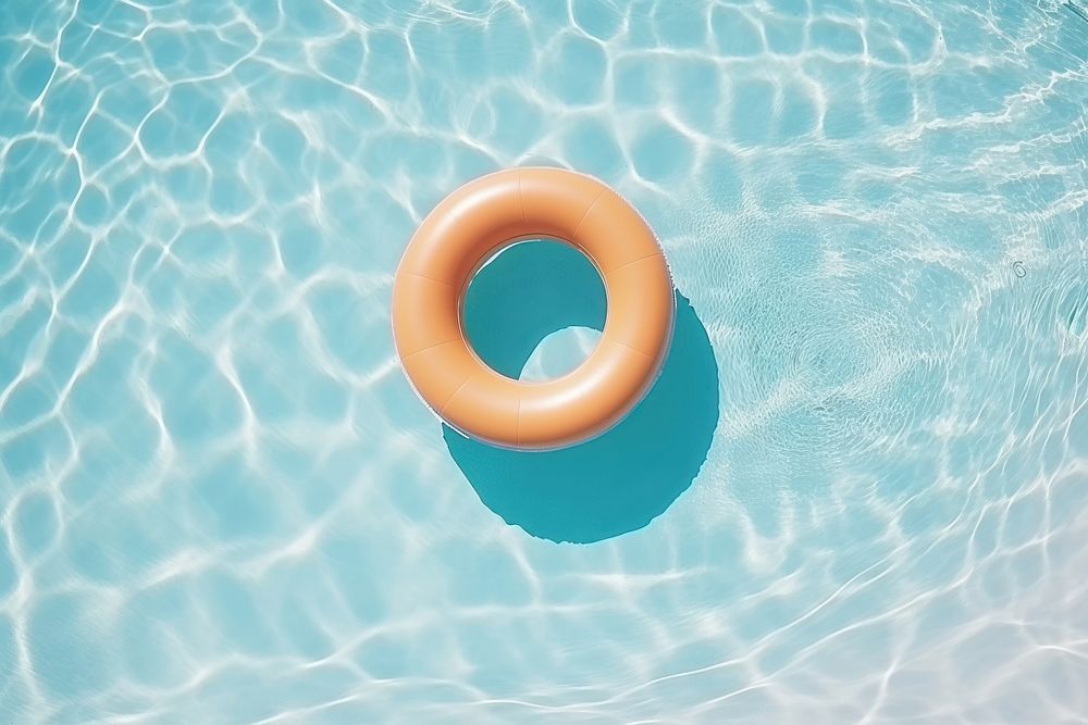 Topview swimming pool with swimming pool ring float sunny day outdoors inflatable lifebuoy.