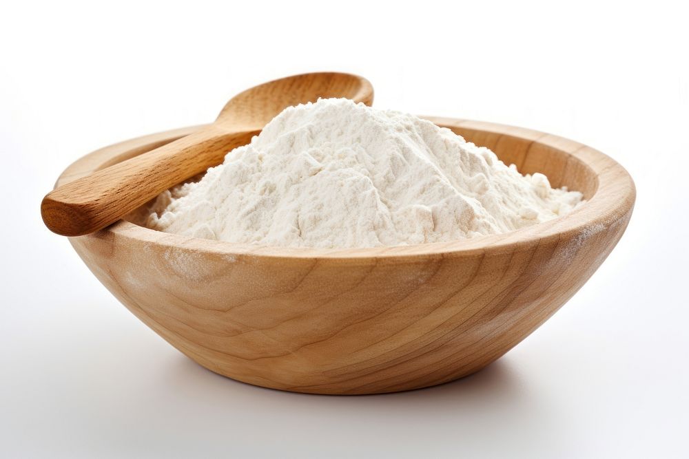 Flour in a wooden bowl flour powder white.