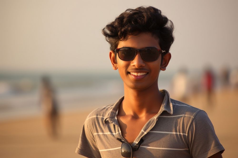 Indian teen age man sunglasses portrait smile.