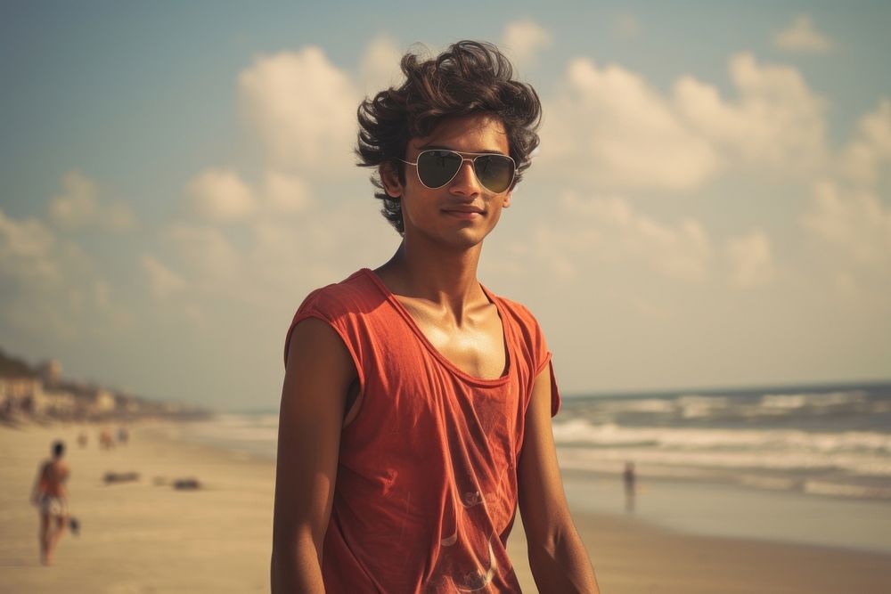 Indian teen age man beach sunglasses portrait.