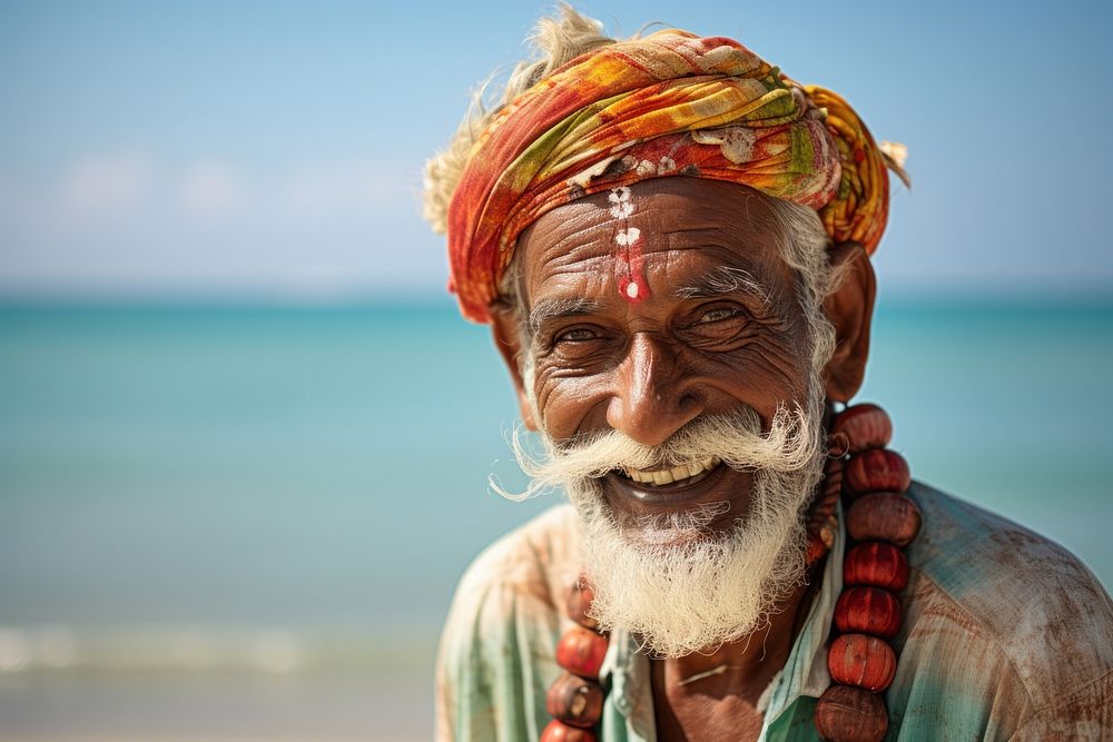 Indian senior man portrait travel beach.