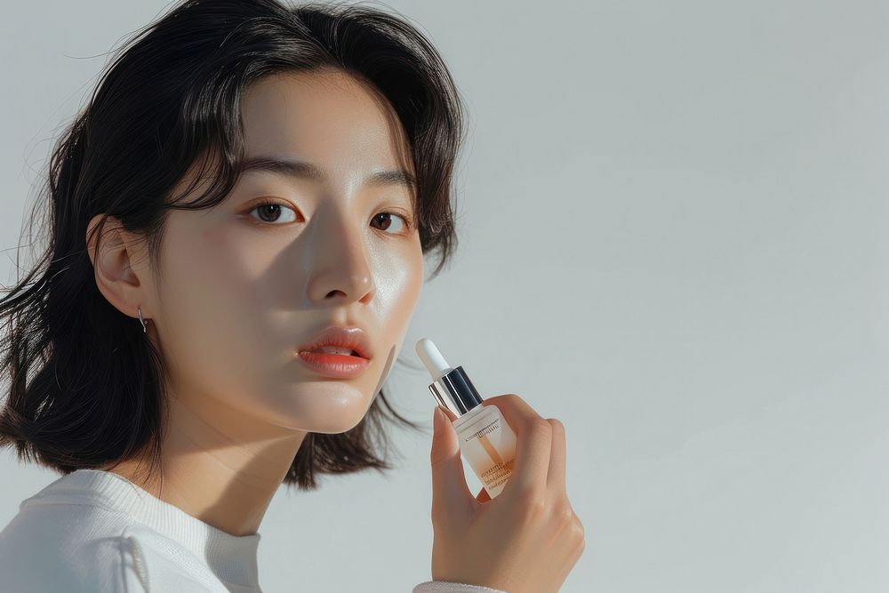 Korean women cosmetics lipstick contemplation.