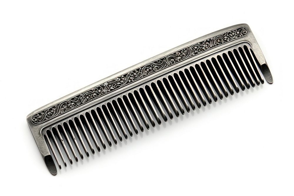 Barbers metal comb white background weaponry blade.