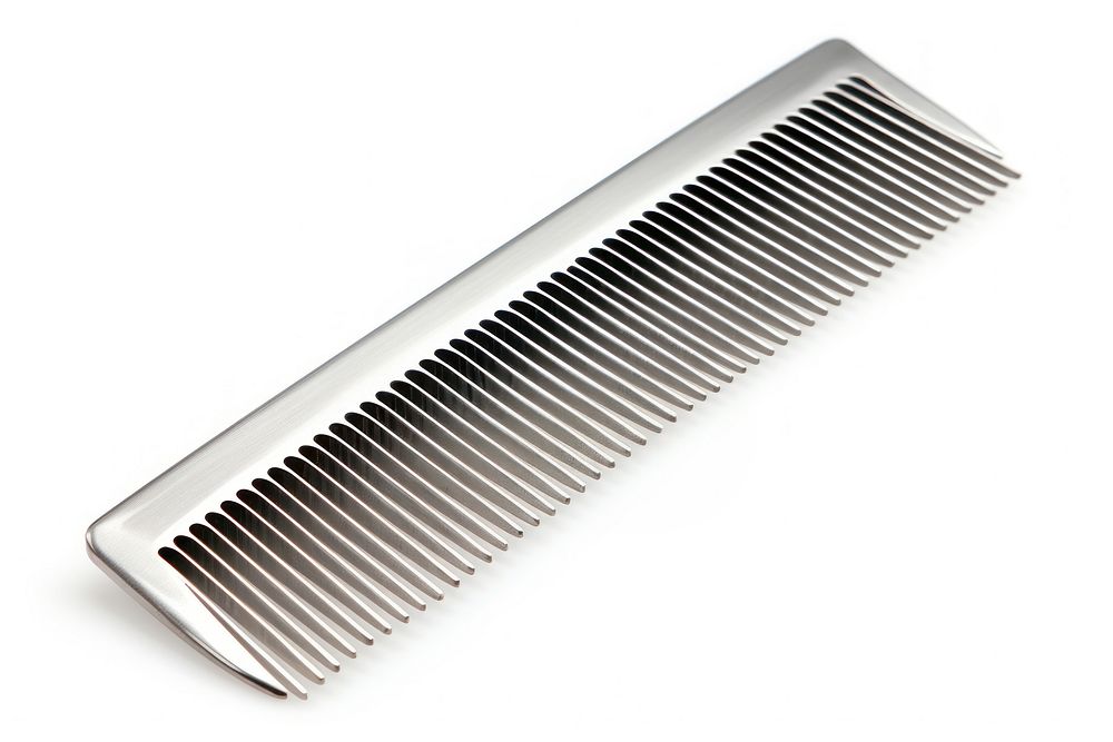 Barbers metal comb white background keyboard pattern.