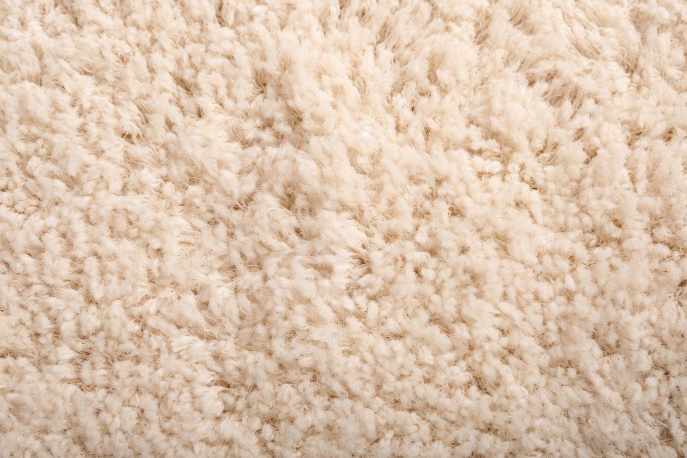 Soft beige carpet backgrounds white wool.