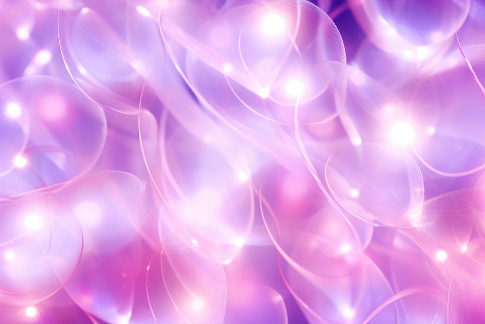 Pink christmas lights blurry pattern purple illuminated backgrounds.