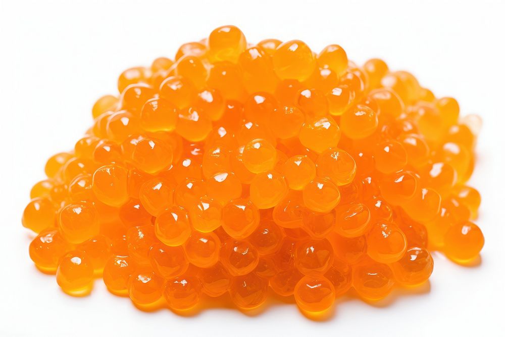 Orange caviar candy pill food.