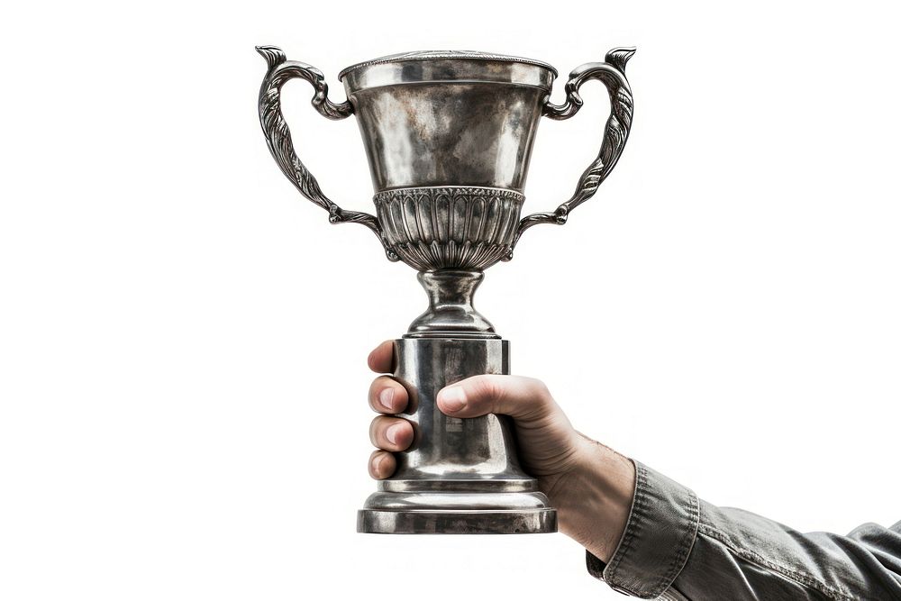 A hand holding up an aged trophy white background achievement midsection.