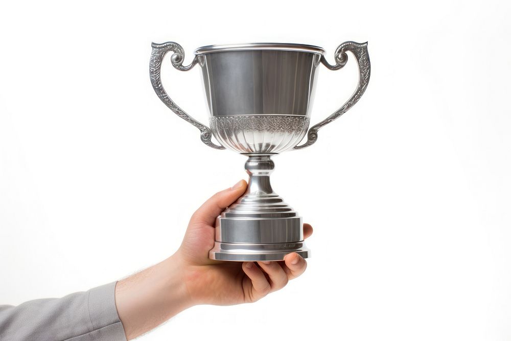 A hand holding up trophy white background achievement midsection.