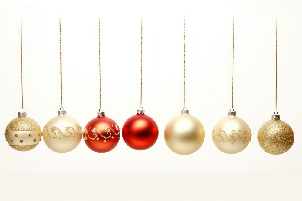 Christmas ornaments hanging red white background.