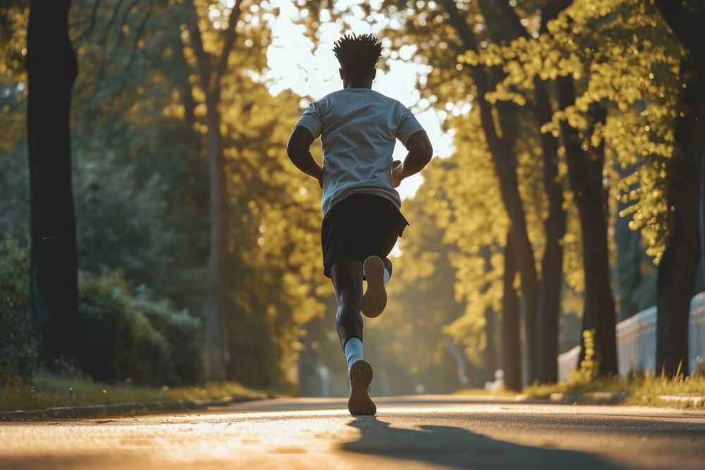 Man jogging running tree determination.