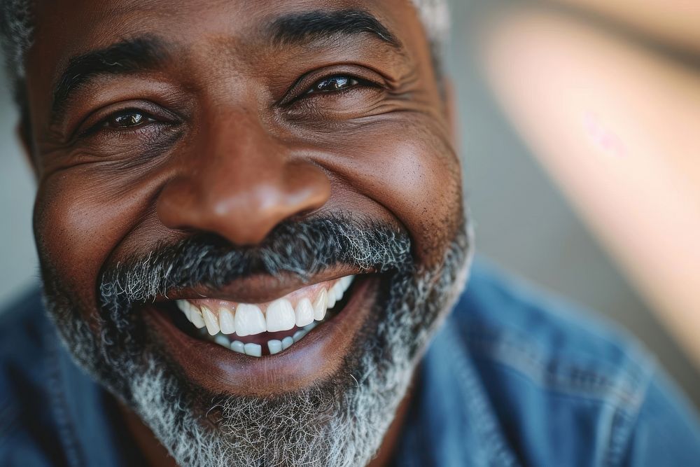 Black man smiling laughing adult teeth.