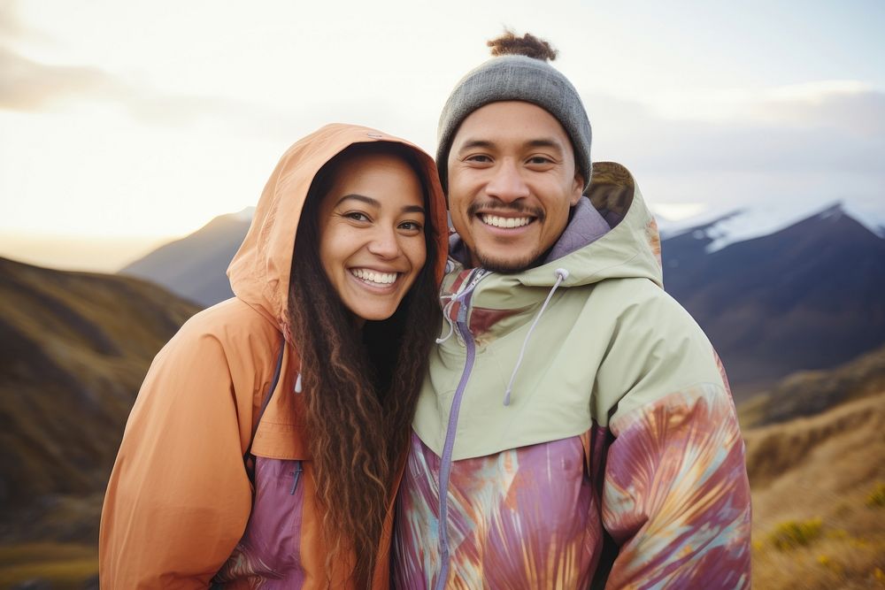 Samoan couple hiking outdoors laughing portrait.