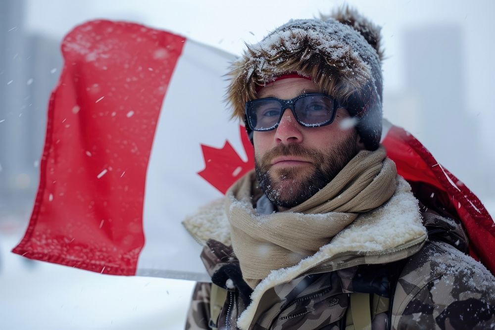 Man holding a flag of canada glasses winter scarf. AI generated Image by rawpixel.