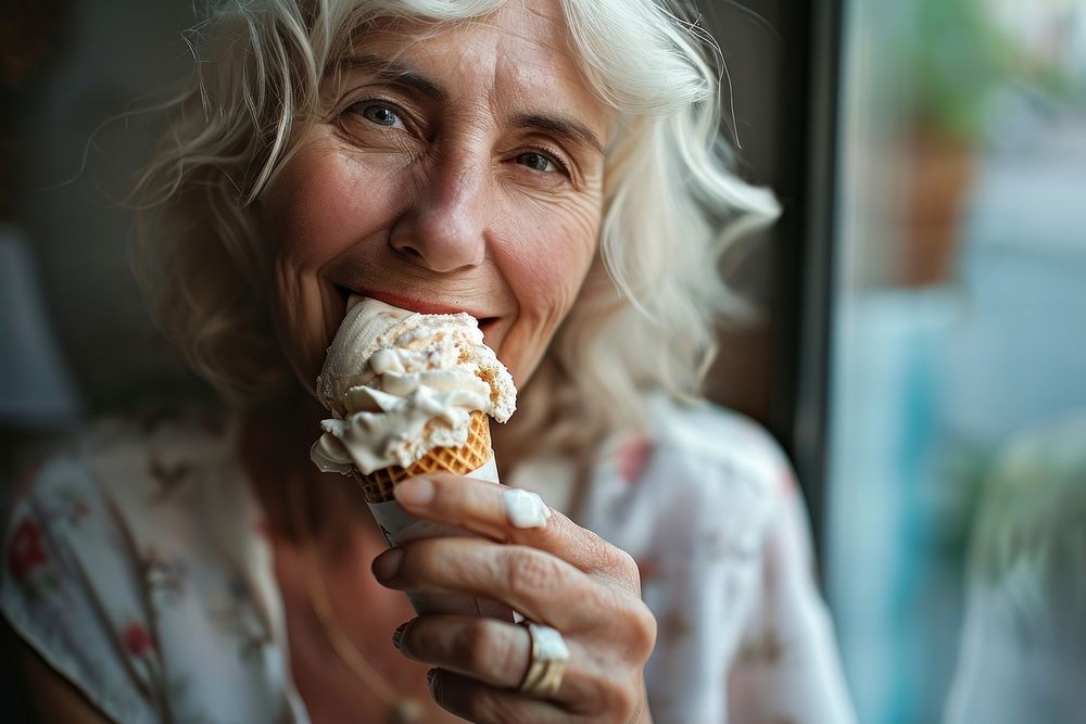 Woman eating ice cream cone dessert biting adult.