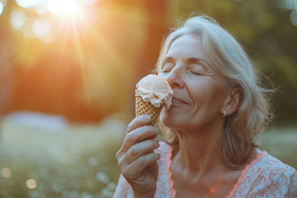Woman eating ice cream cone dessert food relaxation.