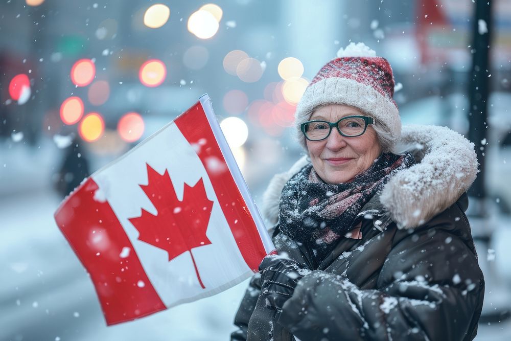Woman holding a flag of canada winter scarf glove. AI generated Image by rawpixel.