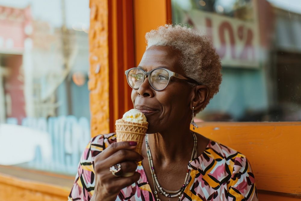 Woman eating ice cream cone glasses adult food.