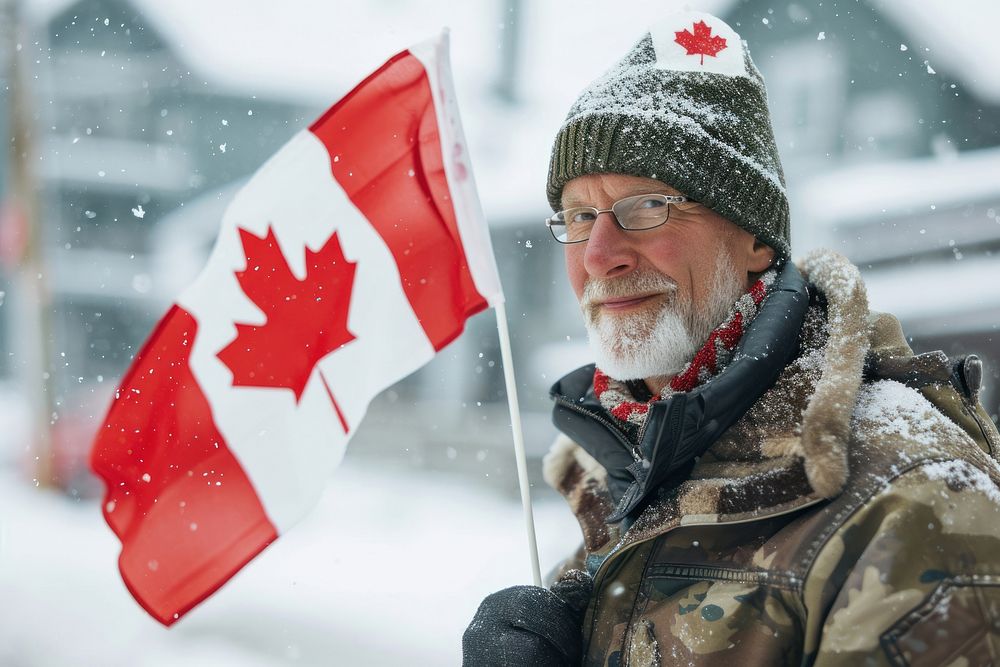 Man holding a flag of canada glasses winter adult. AI generated Image by rawpixel.