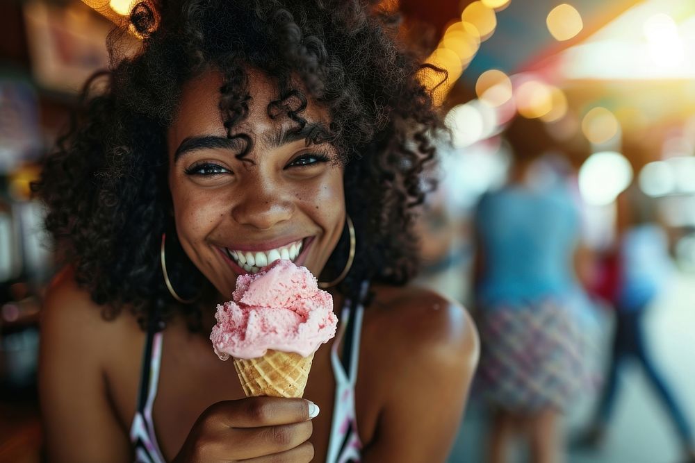 Woman eating ice cream cone dessert smile adult.