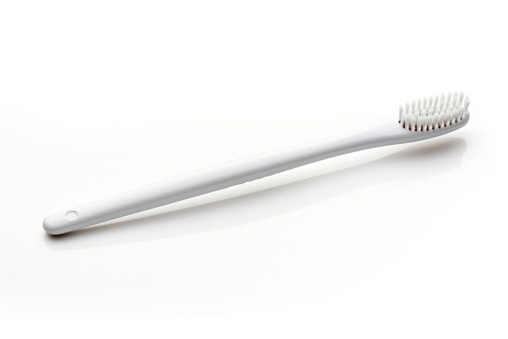 Toothbrush tool white background silverware. AI generated Image by rawpixel.