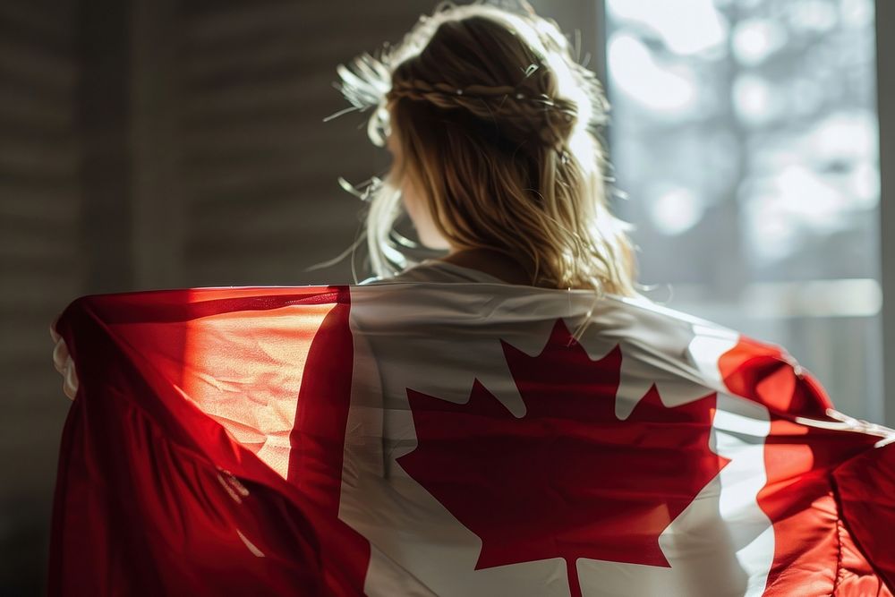 Woman holding in canadian flag adult head patriotism. AI generated Image by rawpixel.