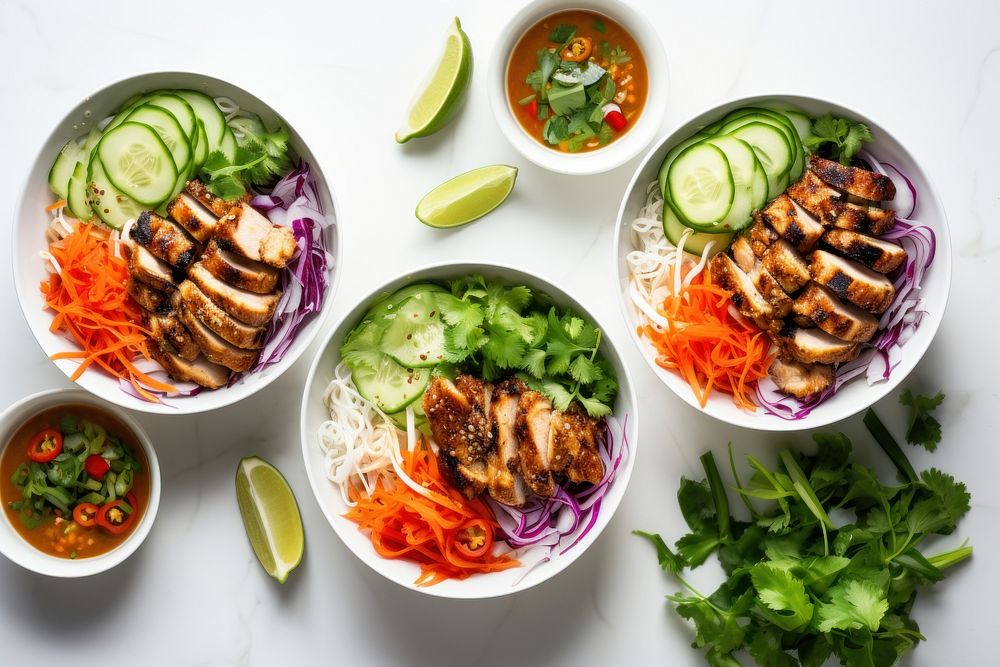 Chicken banh mi noodle bowl lunch table plate.
