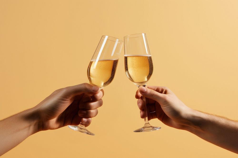 Glass of champagne hand holding drink.