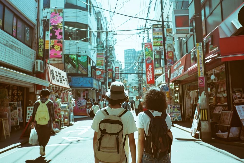 Happy Backpackers in tokyo backpack walking street.