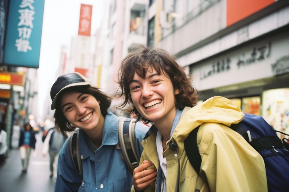 Happy Backpackers in tokyo laughing jacket smile.