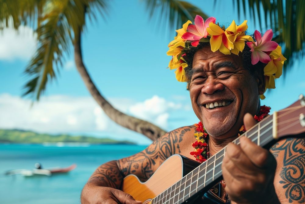 Happy Samoan man flower travel guitar.