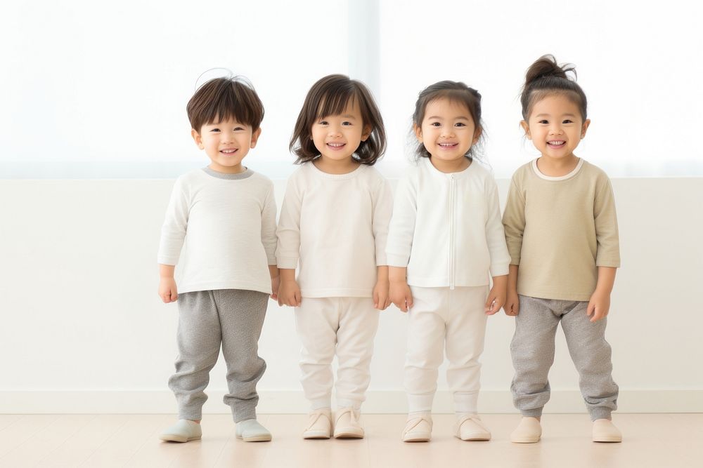 Japanese little 3 toddler boys and girls standing smiling people.