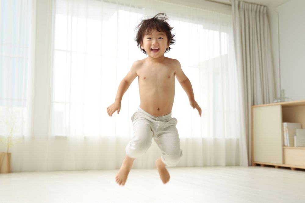 Japanese little todler childs portrait jumping photo.