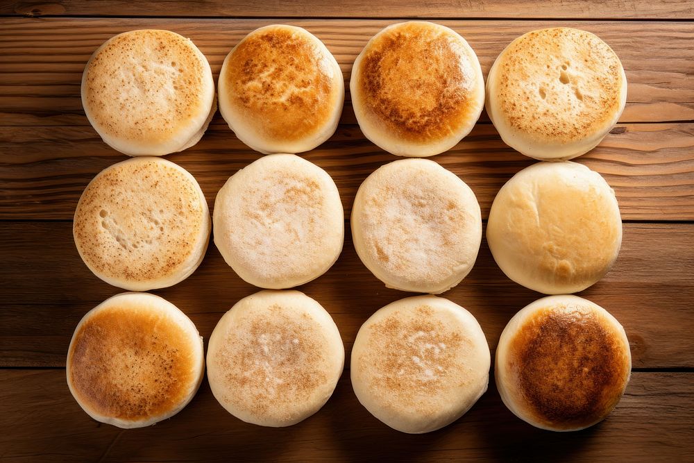 Many english muffins coffee bread table.