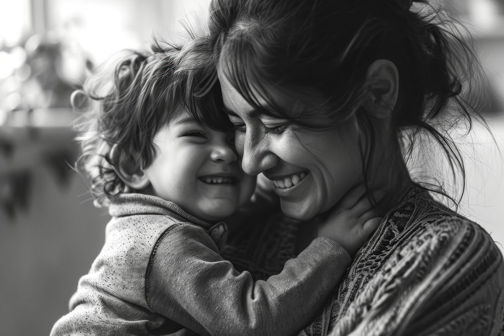 Mother talking to her child laughing portrait hugging. AI generated Image by rawpixel.