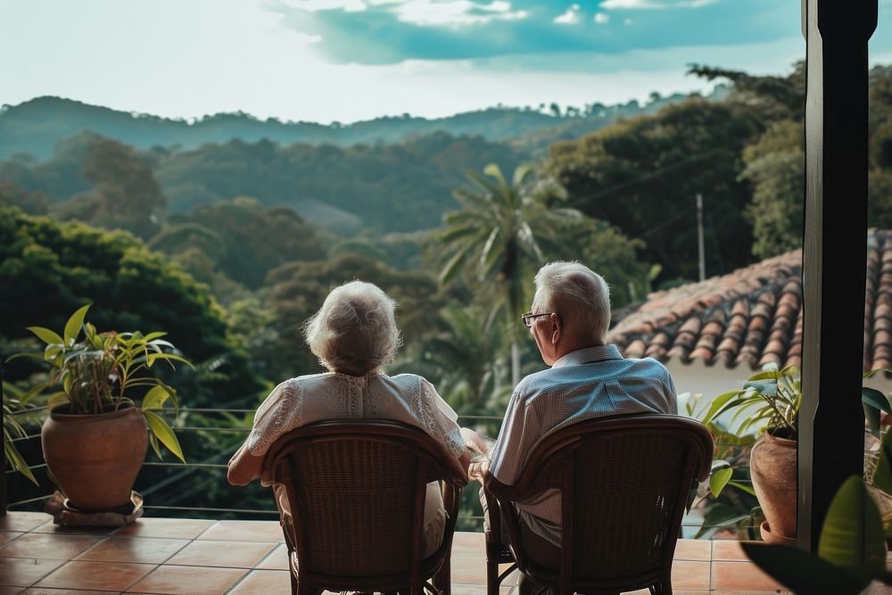 Senior couple in enjoying together outdoor at their terrace outdoors architecture nature.