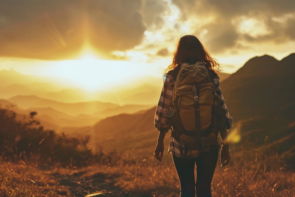 Woman with backpacks silhouette mountain walking. AI generated Image by rawpixel.