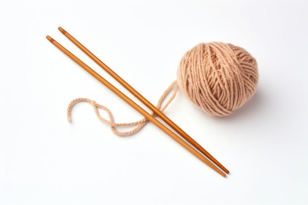Soft wool yarn and two knitting needles chopsticks white background material. AI generated Image by rawpixel.