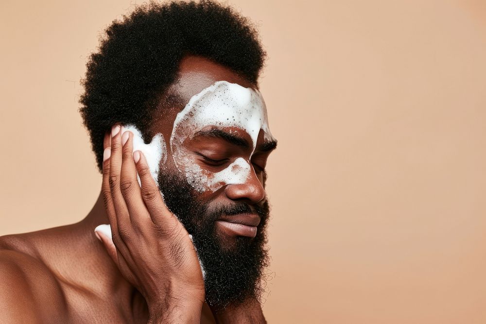 Man using facial wash portrait adult beard.