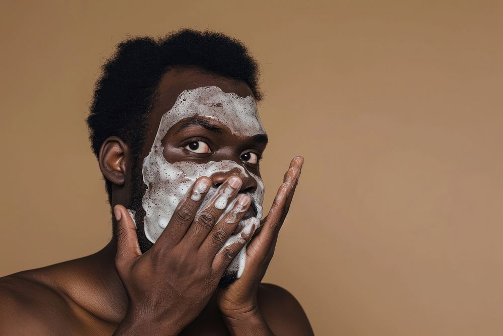 Man using facial wash portrait headshot hygiene.