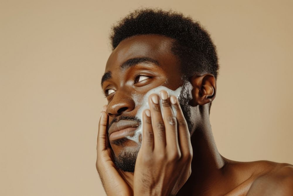 Man using facial wash portrait adult photo.