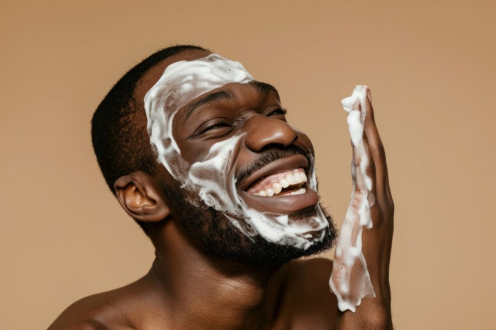 Man using facial wash portrait adult headshot.