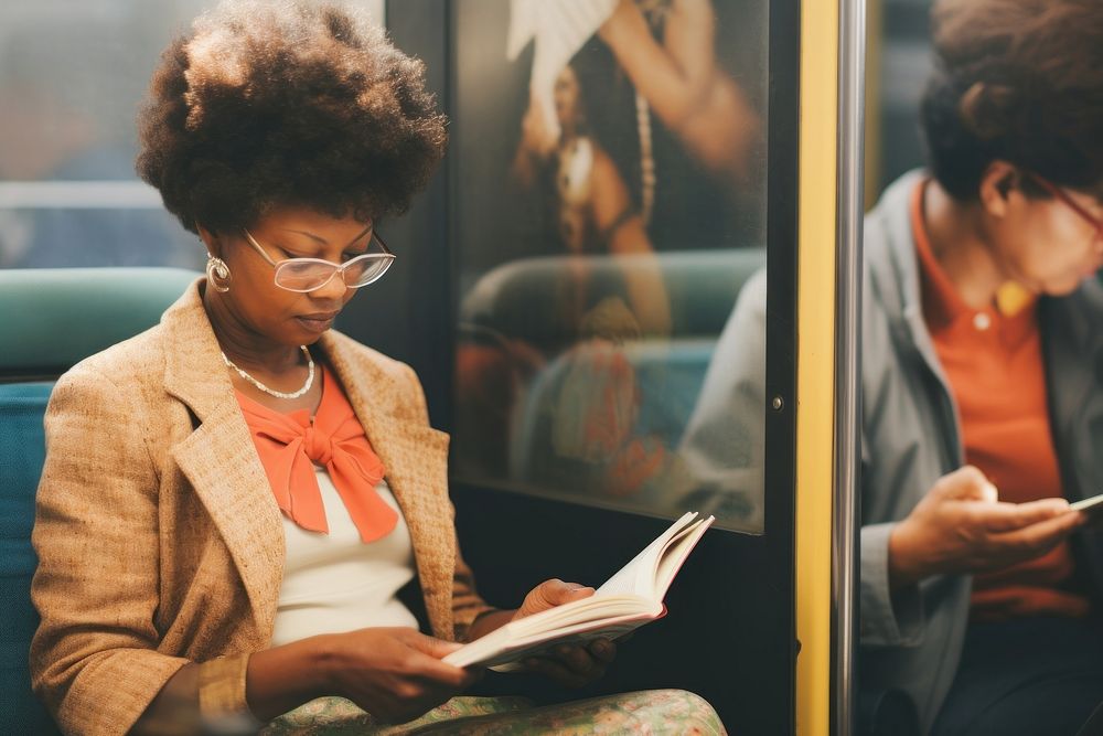 Motion blur old african american woman reading a book in train portrait architecture publication.