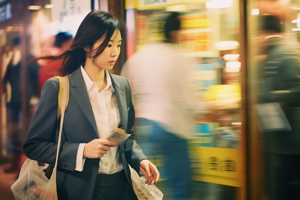 Motion blur businesswoman walking across the street portrait adult bag.