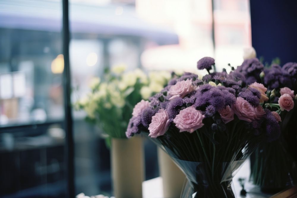 Bouquet in flower shop window purple plant.