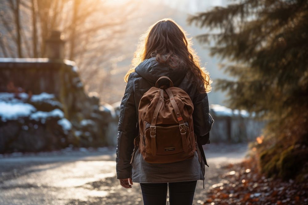 Woman travel in winter season photography backpack walking.