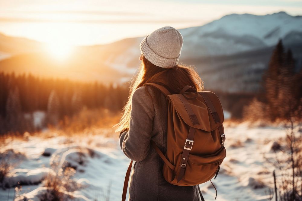Woman travel in winter season photography backpack outdoors.