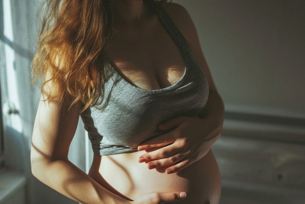 Pregnant woman doing light exercise pregnant adult undergarment. AI generated Image by rawpixel.